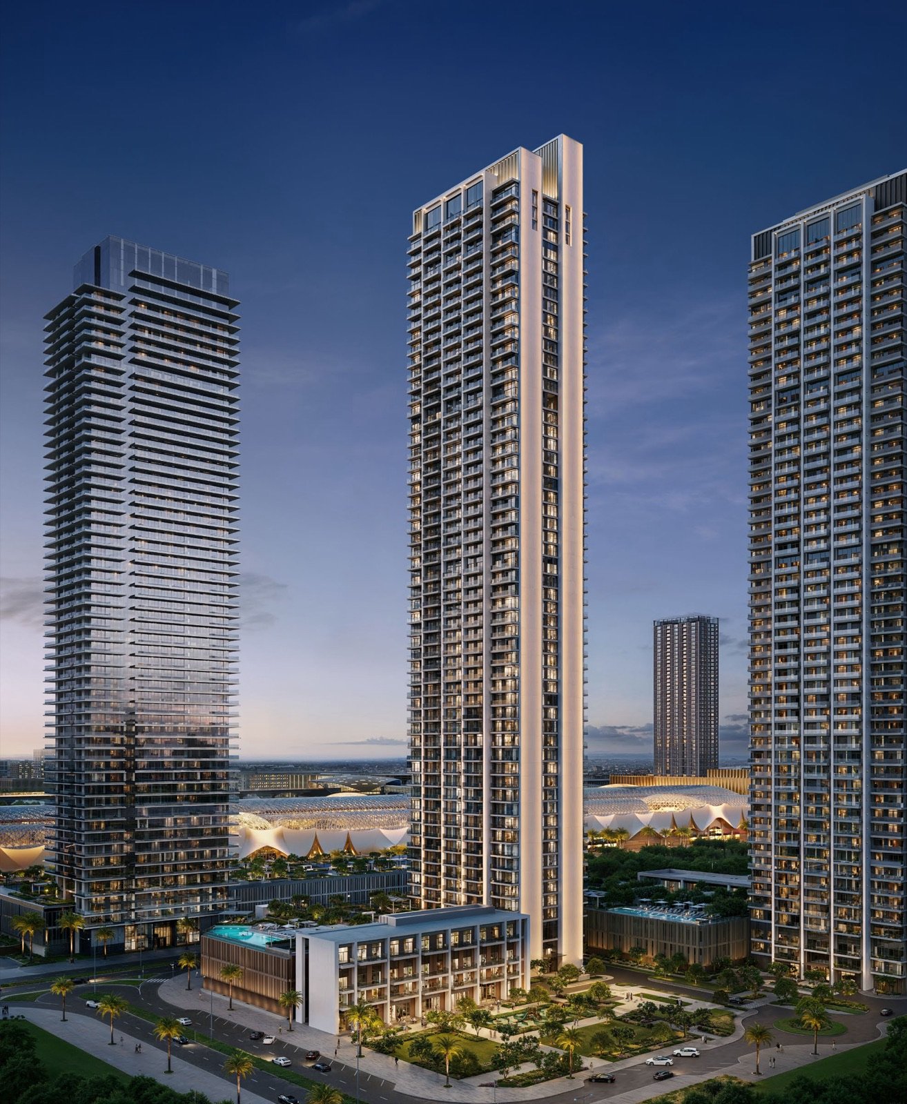 Valia at dusk, three towers above the lit podium
